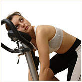 Woman Bored with Exercise Bike