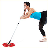 Woman in Ballet Outfit Sweeping Floor
