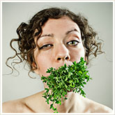 Woman with Salad in Her Mouth