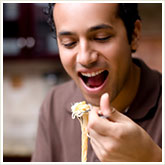 Man Eating Pasta