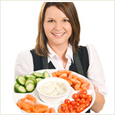 Woman Holding Tray of Veggies and Dip