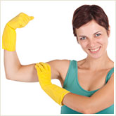Woman in Rubber Gloves Flexing Her Bicep